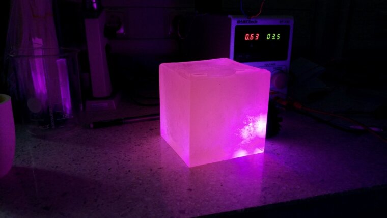 Luminescent glass cube containing europium